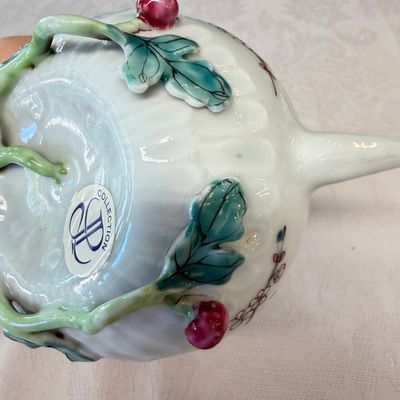 A Chinese famille rose 'Pheasant among Flowering Branches' teapot and cover with relief design — photo 12