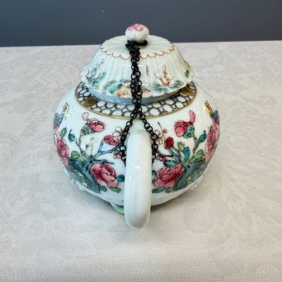 A Chinese famille rose 'Pheasant among Flowering Branches' teapot and cover with relief design — photo 2