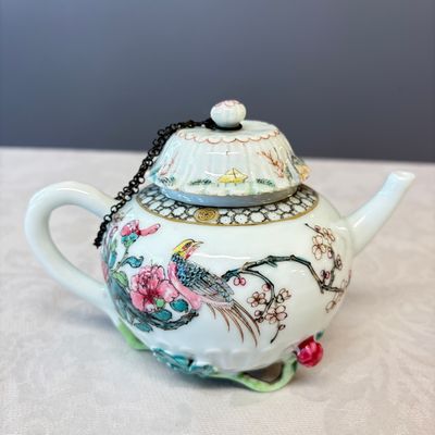 A Chinese famille rose 'Pheasant among Flowering Branches' teapot and cover with relief design — photo 3
