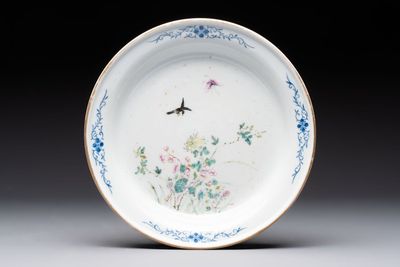 A Chinese famille rose plate with a bird and butterfly among blossoming branches, Yongzheng mark, Republic