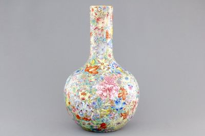 A Chinese famille rose porcelain millefleurs bottle vase, 19th C.