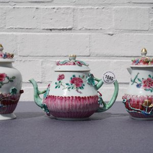 A Chinese famille rose relief-decorated teapot, milk jug and tea caddy on stands, Yongzheng — 照片 11