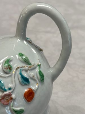 A Chinese famille rose relief-decorated teapot with floral design — photo 12