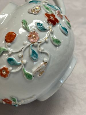 A Chinese famille rose relief-decorated teapot with floral design — photo 13