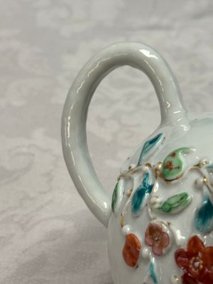 A Chinese famille rose relief-decorated teapot with floral design — photo 16