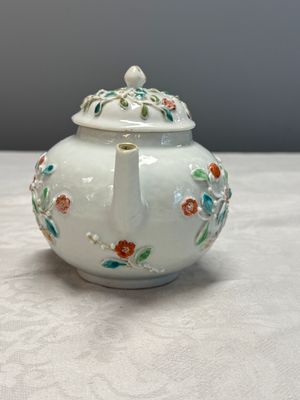A Chinese famille rose relief-decorated teapot with floral design — photo 4