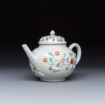 A Chinese famille rose relief-decorated teapot with floral design, Yongzheng