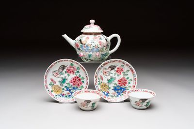 A Chinese famille rose 'roosters' covered teapot and two cups and saucers, Yongzheng