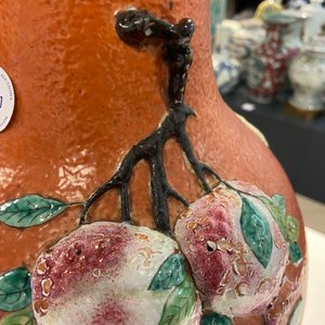A Chinese famille rose 'sanduo' vase with applied design on a coral red ground, 19th C. — photo 11