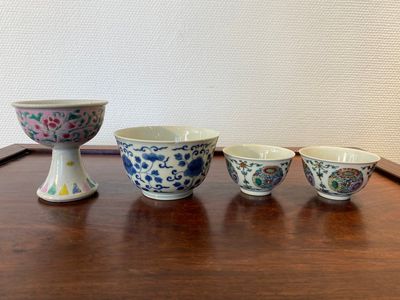 A Chinese famille rose stem cup, a blue and white bowl and a pair of doucai bowls, Yongzheng and later — photo 1