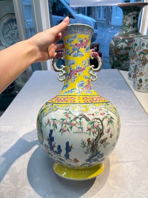 A Chinese famille rose yellow-ground ‘Bats and Peaches’ bottle vase, Jiaqing/Daoguang — photo 1