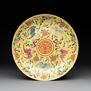 A Chinese famille rose yellow-ground 'bats and peaches' plate, Tongzhi mark and of the period — photo 1