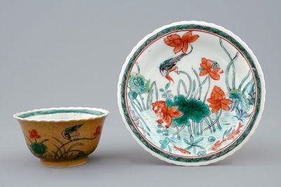 A Chinese famille verte and café au lait cup and saucer, Kangxi