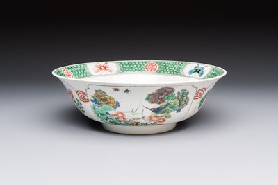 A Chinese famille verte bowl with bird and butterflies among flowers, lozenge mark, Kangxi