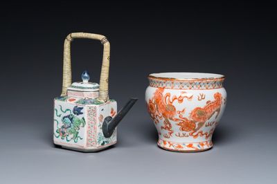 A Chinese famille verte 'Buddhist lions' teapot and a Thai market spittoon, Kangxi and later
