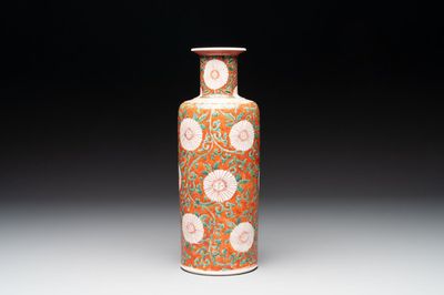 A Chinese famille verte coral-red-ground rouleau vase with flower scrolls, Kangxi
