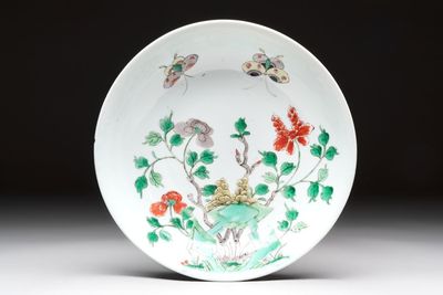 A Chinese famille verte 'peonies and butterflies' plate, Kangxi