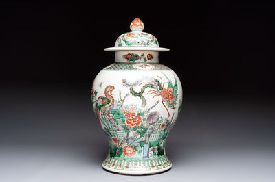 A Chinese famille verte 'phoenixes' vase and cover, 19th C.
