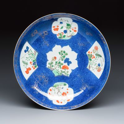 A Chinese famille verte powder blue-ground dish with floral panels, Kangxi