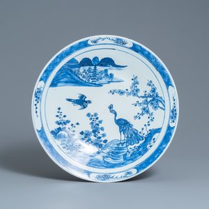 A Chinese famille verte 'yenyen' 'rice production' vase and a large blue and white 'peacock' dish, 19th C. — photo 2