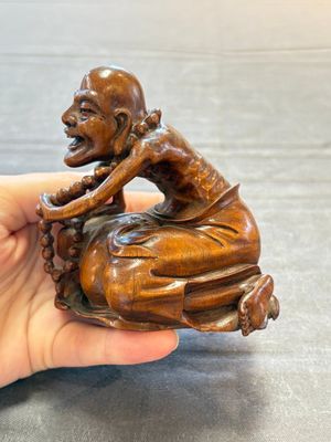 A Chinese fine huanghuali sculpture of a Luohan on a zitan stand, Qianlong mark, 19/20th C. — photo 6
