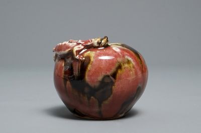 A Chinese flambé-glazed brush washer with applied dragon, 18/19th C.