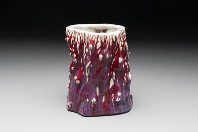 A Chinese flambé-glazed trunk-shaped brush pot, 19th C.