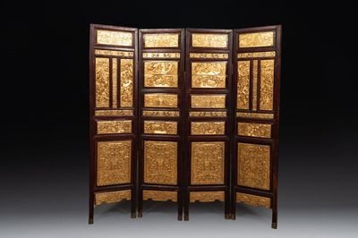 A Chinese four-part reticulated and partially gilt wooden folding screen, 19th C.