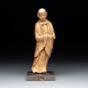 A Chinese gilt and polychromed stucco figure of a monk, Ming — photo 1