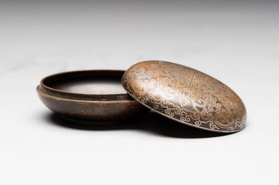 A Chinese gilt and silver inlaid bronze ink paste box and cover and with presentation box, Qianlong mark and possibly of the period