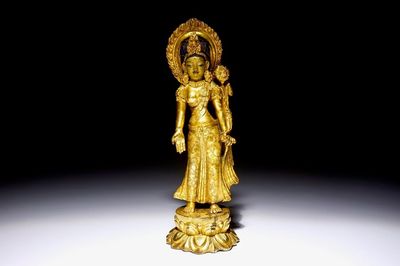 A Chinese gilt bronze figure of Tara standing on a lotus base, 19th C.