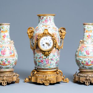 A Chinese gilt bronze-mounted three-piece Canton famille rose clock garniture, 19th C. — photo 1