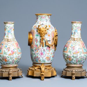 A Chinese gilt bronze-mounted three-piece Canton famille rose clock garniture, 19th C. — photo 2