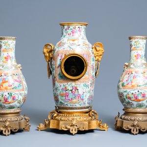 A Chinese gilt bronze-mounted three-piece Canton famille rose clock garniture, 19th C. — photo 3