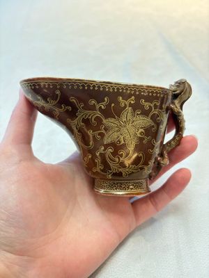 A Chinese gilt-decorated brown-glazed libation cup with a chilong-form handle, Qianlong mark and of the period — photo 1