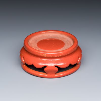 A Chinese gilt-decorated coral-red-glazed stand, Qianlong mark and possibly of the period
