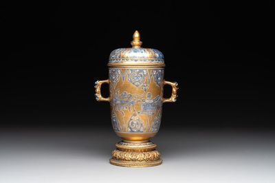 A Chinese gilt-ground blue and white lidded beaker on a French gilt bronze foot, Kangxi