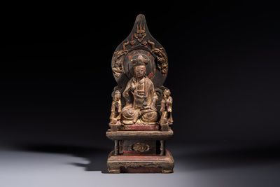 A Chinese gilt-lacquered wooden Bodhisattva and attendants on a throne, Qing