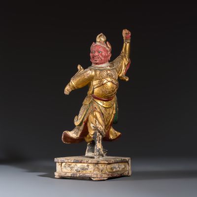 A Chinese gilt-lacquered wooden figure of a Heavenly King, 19th C.