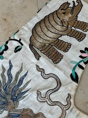 A Chinese gilt-metal embroidered silk 'animals' children's robe, 19/20th C. — photo 17