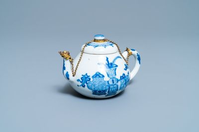 A Chinese gilt-mounted blue and white teapot and cover, Jiajing mark, Kangxi