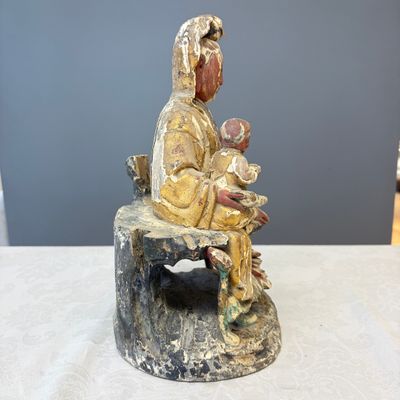 A Chinese gilt-polychromed carved wooden group of Guanyin and child — photo 4