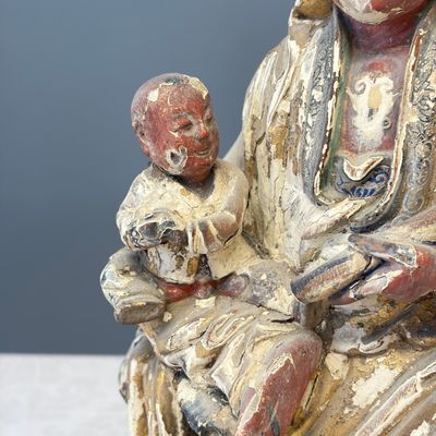 A Chinese gilt-polychromed carved wooden group of Guanyin and child — photo 6