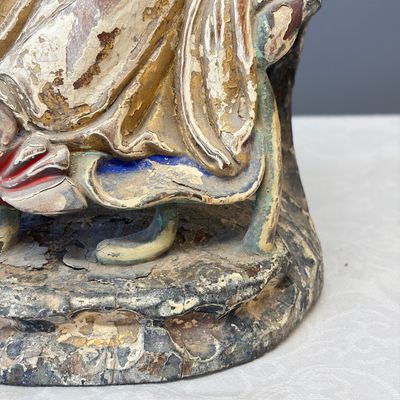 A Chinese gilt-polychromed carved wooden group of Guanyin and child — photo 11