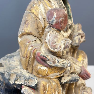 A Chinese gilt-polychromed carved wooden group of Guanyin and child — photo 15