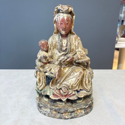 A Chinese gilt-polychromed carved wooden group of Guanyin and child — photo 1
