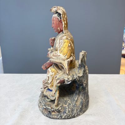 A Chinese gilt-polychromed carved wooden group of Guanyin and child — photo 2