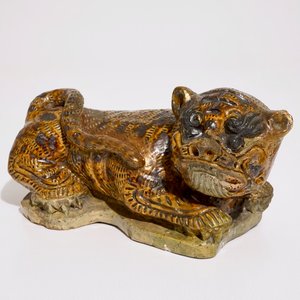A Chinese glazed stoneware model of a tiger, probably Ming — photo 1