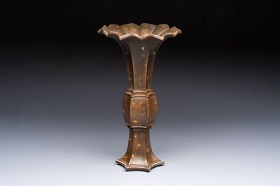 A Chinese gold-splashed bronze 'Gu' vase, Xuande mark, 17/18th C.
