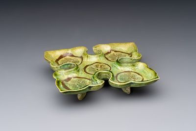 A Chinese green-glazed marbled dish, probably Tang